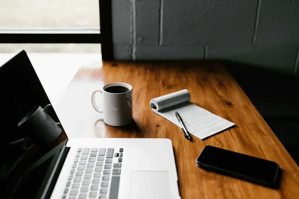 Digital workspace with laptop and smartphone